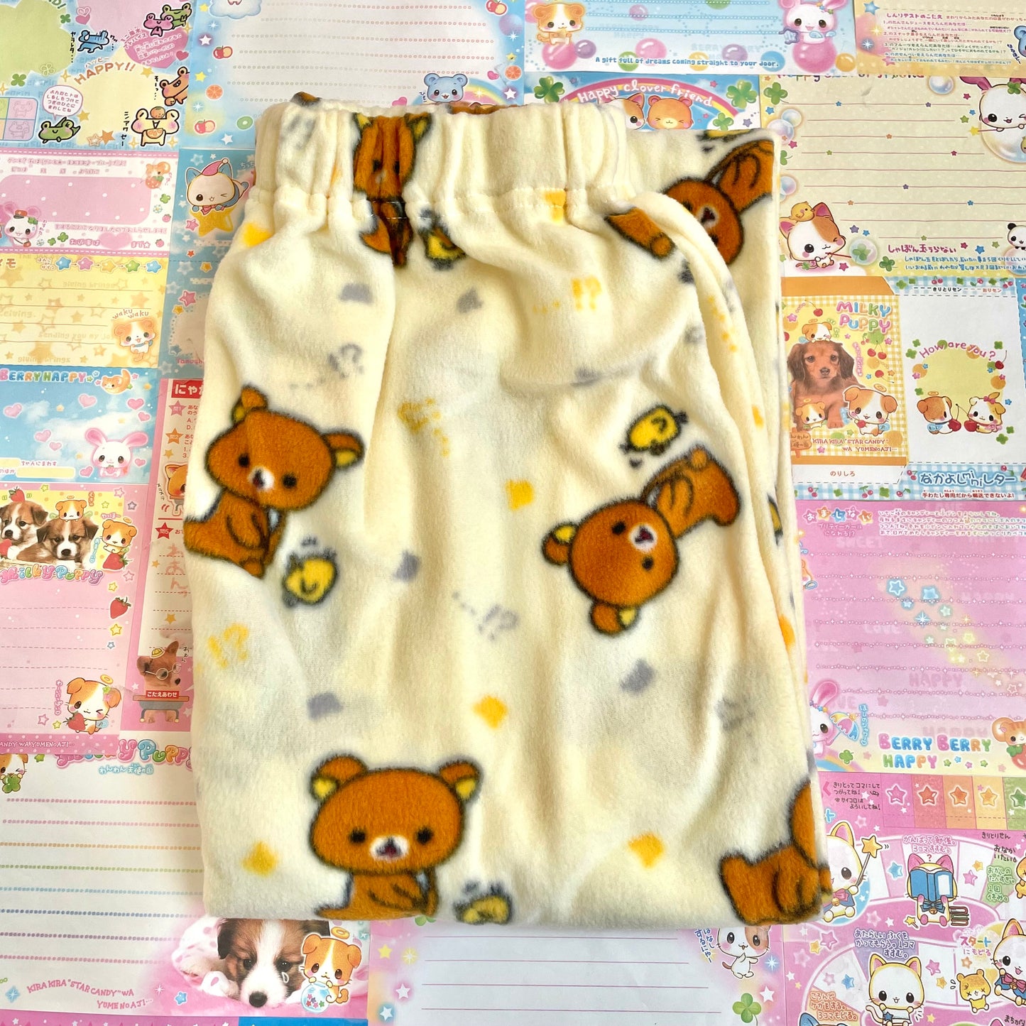 A set of 2 Rilakkuma M Fluffy Roomwear and a Drawstring Bag